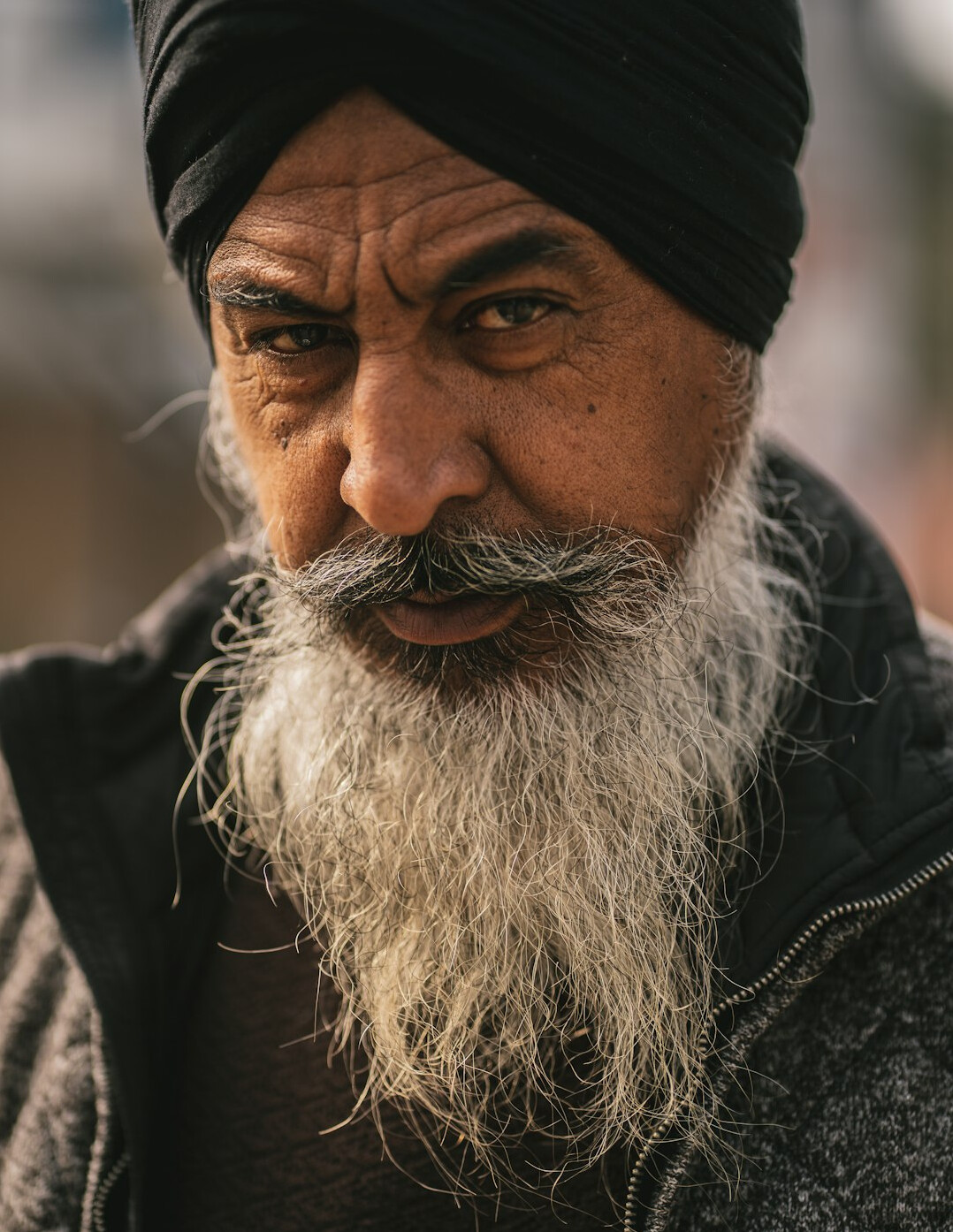 Portrait of a man with a beard looking at the camera