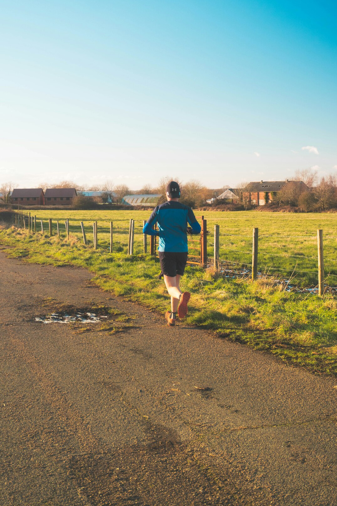 Man running outdoors on a path in the morning