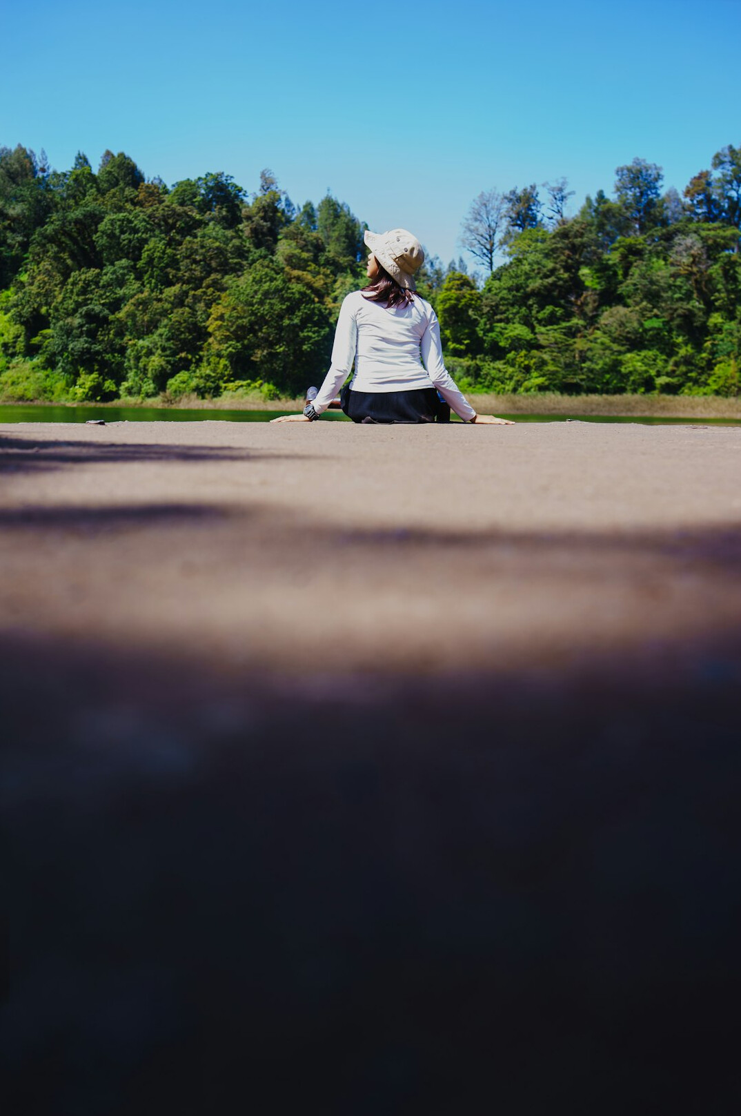 Woman practicing yoga outdoors in calm natural light