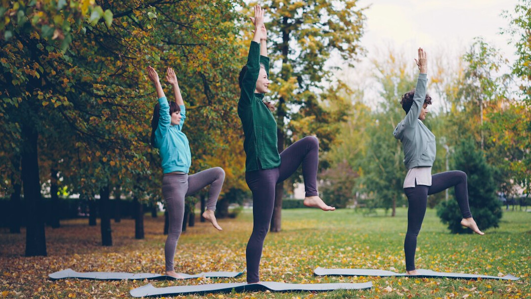 woman practicing yoga outdoors