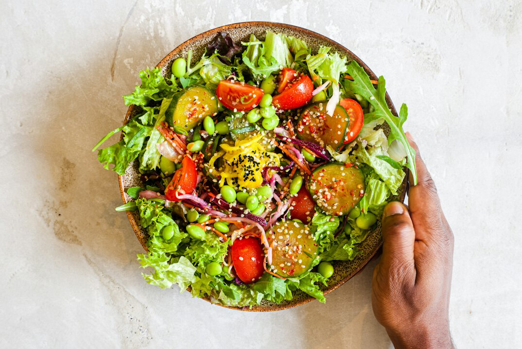 Fresh healthy salad bowl with vegetables on a table